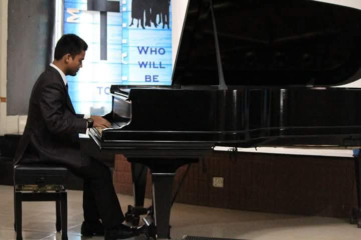 Reading sheet music at piano